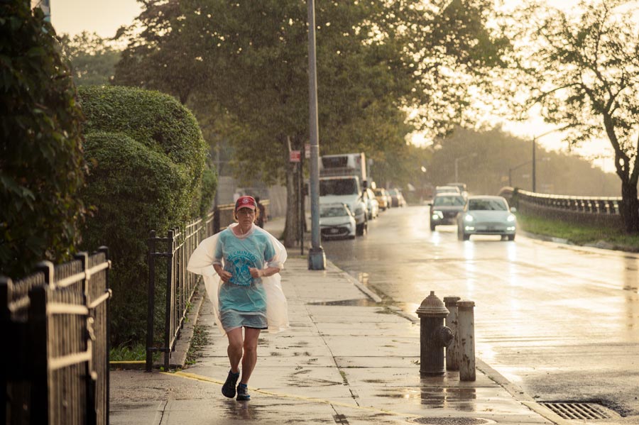 Susan Marshall runs through the rain